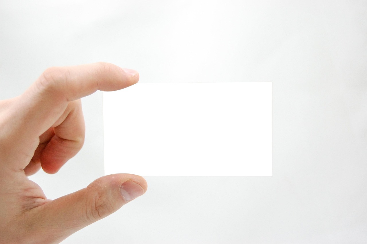 Business card, business, hand — Your Financial Safety Net Demystified Understanding How Social Security Bolsters Stability